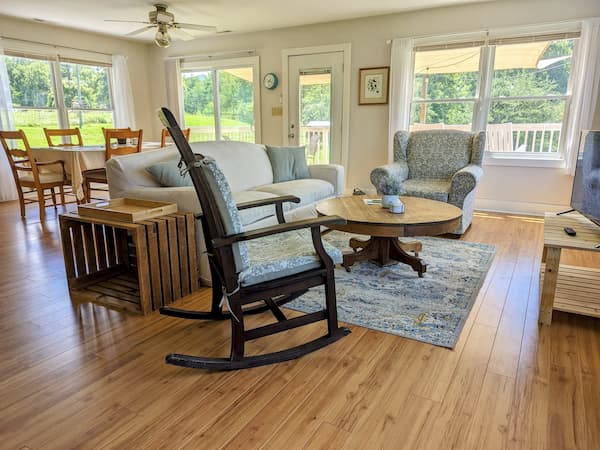 Open living and dining area inside the main farmhouse